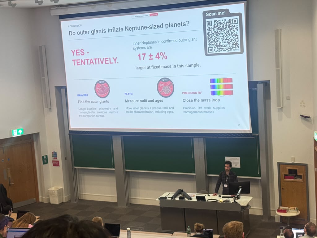 Dolev Bashi presenting research on Neptune-sized planets in a university lecture hall.